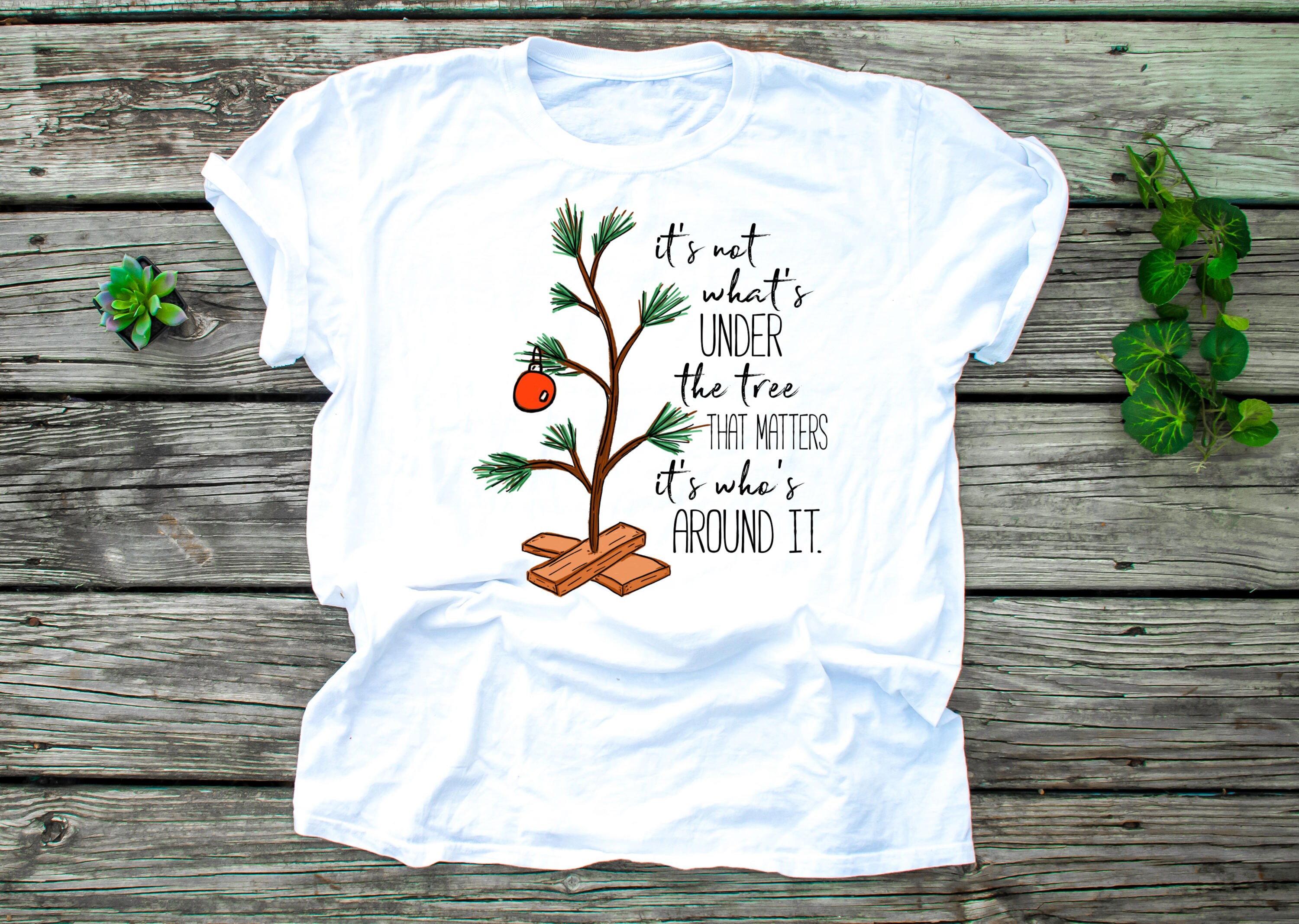 Discover It's not what's under the tree that matters, it's what's around it Charlie Brown T-Shirt