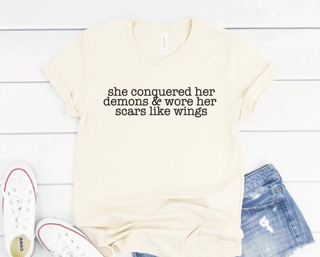 She Conquered Her Demons and Wore Her Scars Like Wings. Bella Canvas