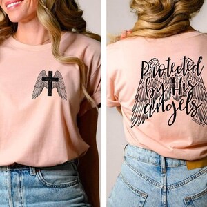 Protected by his Angels.Double sided tee. Pocket tee. Jesus. Keep the faith. Screen printing. Bella Canvas. Free shipping