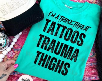 I’m a triple threat, tattoos trauma thighs. . Bella canvas. Comfort Colors. Free shipping.