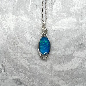 Wire wrapped pendant-Blue aurora opal doublet wrapped in sterling silver wire