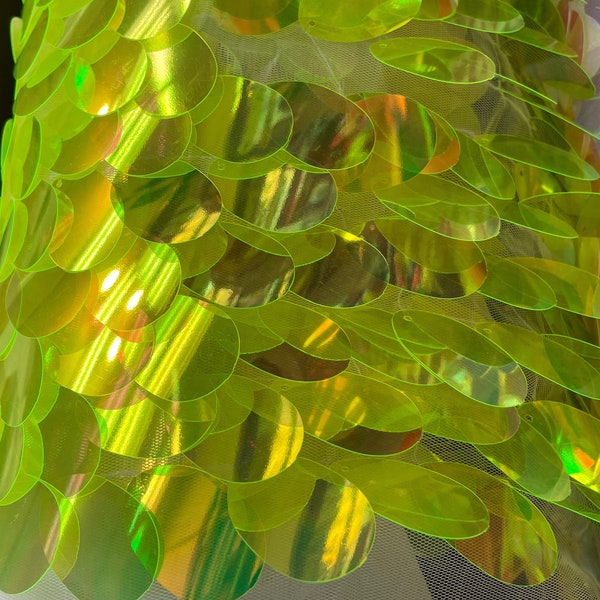 New neon lime green iridescent Jumbo Tear drop sequins sewn on white mesh fabric sold by yard 58” wide fabric