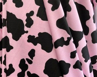 Cow Print Pink/Black on poly Spandex Lycra Fabric. 4 way Stretch Fabric sold by yard