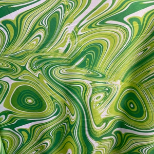 Green/white Lava Print on poly spandex fabric 4 way Stretch fabric sold by yard 60” wide