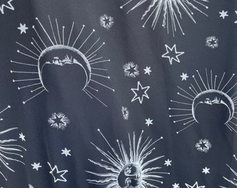 Moons and suns print on black mesh fabric 4 way stretch 60” wide fabric sold by yard