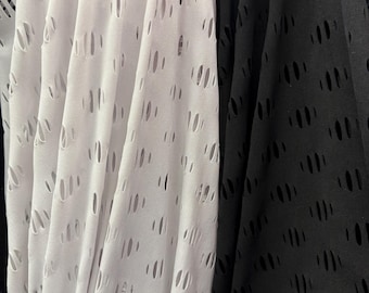 New ripped fishnet fabric 4 way stretch black and white colors. 60” wide fabric. Sold by yard