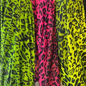 New Cheetah/ Leopard print 4 way stretch Spandex Fabric sold by yard. Ombré cheetah print bright colors (60” wide fabric)
