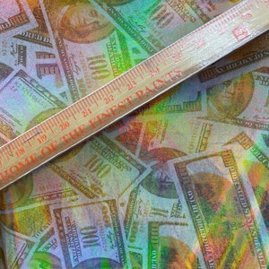 Gold iridescent Metallic money print. Benjamin 100 USD print on spandex fabric 4 way Stretch sold by yard 60” wide