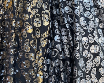 Metallic skulls print nylon spandex fabric 4 way stretch fabric sold by yard. Gold and silver color available. Black base, 60” wide fabric