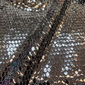 Black Honeycomb Sequins on silver and black Spandex lurex fabric , 58/60 inch wide, sold by the yard. 2 way stretch