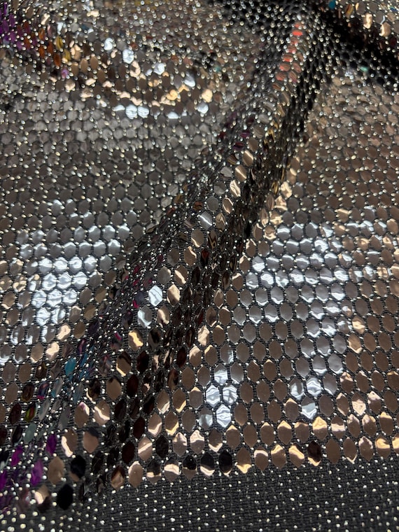 Black Honeycomb Sequins on silver and black Spandex lurex fabric , 58/60 inch wide, sold by the yard. 2 way stretch