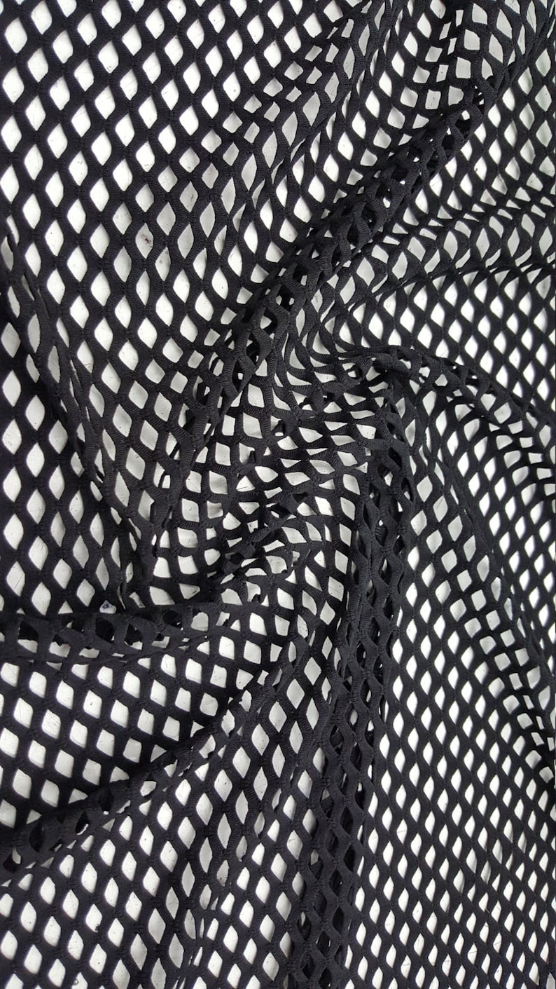 May include: Black diamond-shaped mesh fabric with a textured surface.