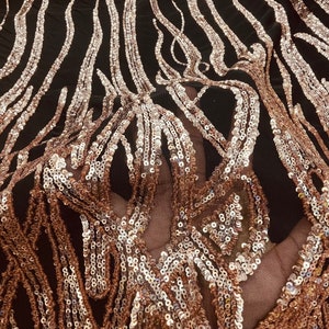 New Rose Gold sequins flames Desings on black mesh fabric. 54” wide fabric sold by yard ( non stretch fabric)