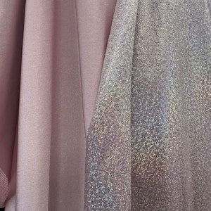 Light pink metallic hologram on Light Pink Nylon Spandex base.  Fabric Sold by the yard. 60” wide
