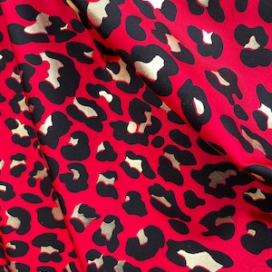 4 Way Stretch Leopard Animal Print with Gold Lurex on Bright Red Spandex Fabric sold by yard