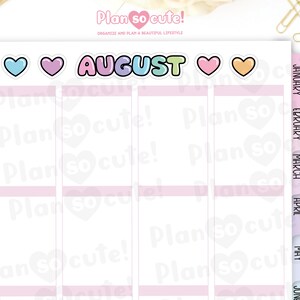 May include: A monthly planner with a pink and white design. The month of August is highlighted with a colorful sticker. The planner has tabs for each month of the year.