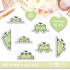May include: Set of six printable die cut stickers featuring cute green frogs with a sprout on their head peeking over a white line. The text "Printable Die Cuts" is in green on a white heart shape.