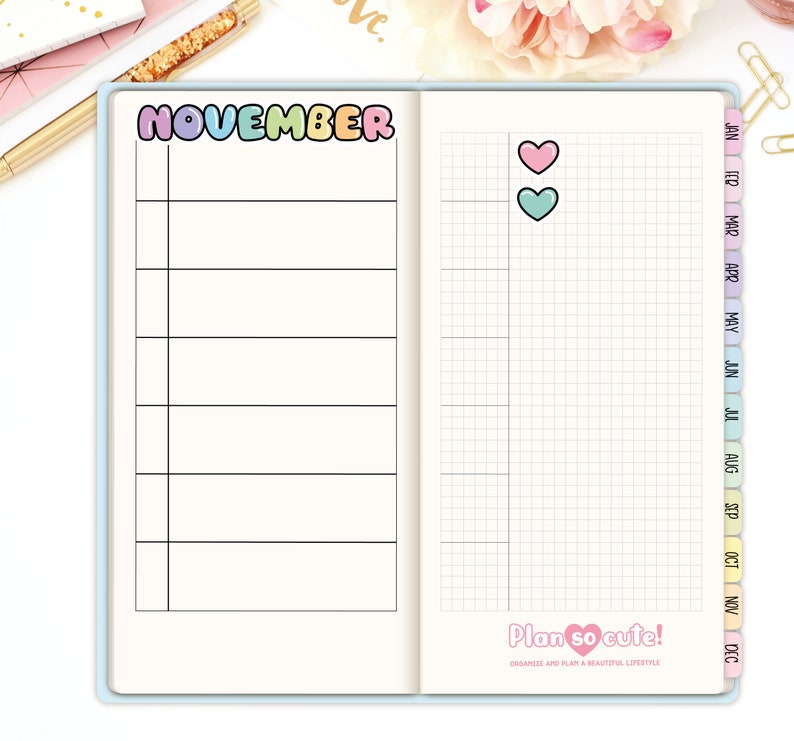 May include: A monthly planner page with a colorful "NOVEMBER" title and a gridded section for daily notes. The page also includes a small section with two hearts, one pink and one teal.