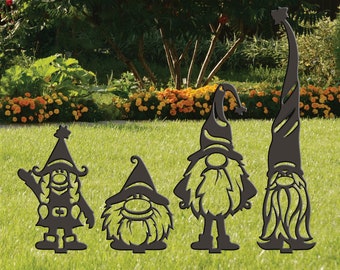 May include: Four black metal silhouette gnomes of varying sizes standing in a grassy lawn. The gnomes are all wearing pointy hats and have long beards.