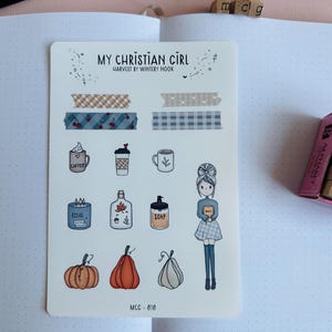 May include: A sticker sheet titled My Christian Girl Harvest by Wintery Nook featuring various illustrations including washi tape strips, coffee mugs, a candle, a soap dispenser, pumpkins, and a person holding a book, labeled with MCC-010.