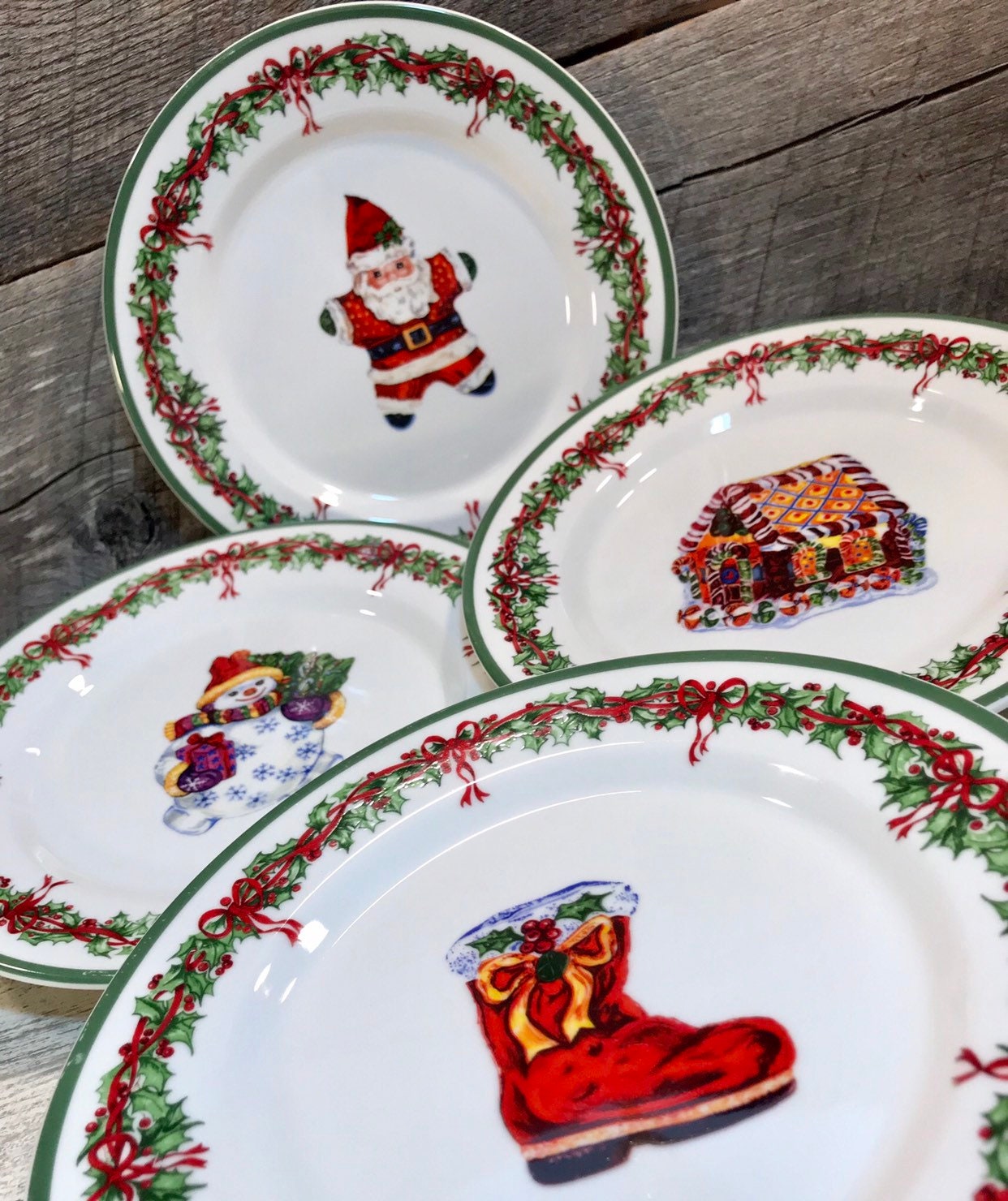 Set of 4 (Four) SALAD PLATES in the Holiday Celebrations (Green Trim) Pattern by Christopher Radko, Santa, Boot, Gingerbread House, Snowman,