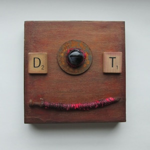Mixed Media Smiling Face Assemblage Art on Wood Panel Found Objects OOAK