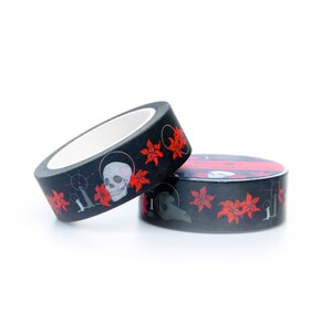 May include: Two rolls of black washi tape with a repeating pattern of red flowers, skulls, and a plague doctor mask.
