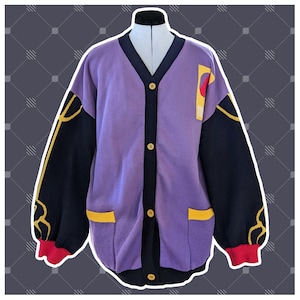 May include: A purple cardigan with black and yellow trim. The cardigan has a button-up front and long sleeves.