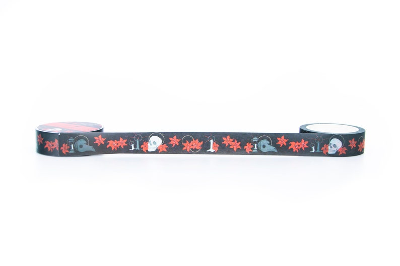 May include: Black and red washi tape with a repeating pattern of skulls, candles, and flowers.