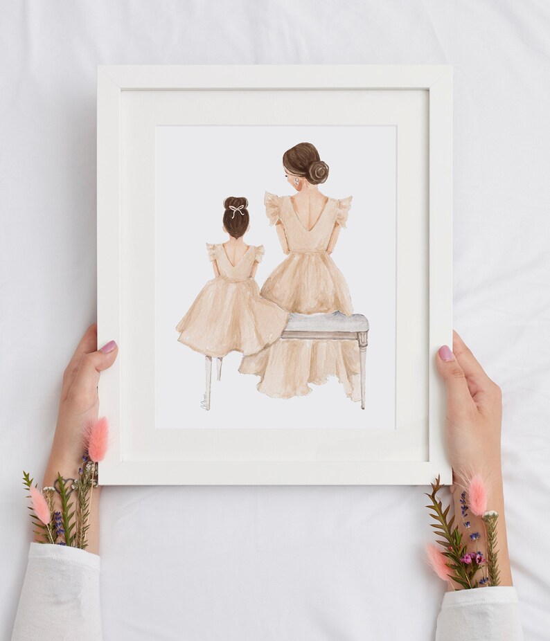 May include: A watercolor illustration of two people in beige dresses, one sitting on a bench and the other standing behind her. The illustration is framed in a white frame.