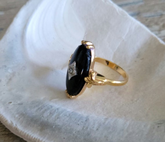 Avon black onyx ring, 1983 'Victorian' faux black onyx and diamond chip, gold tone, rhinestone accent