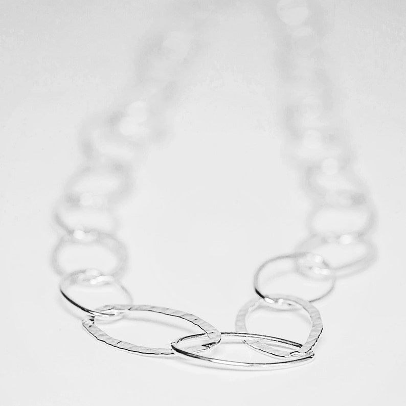 Long silver necklace hammered /& plain ovals .
