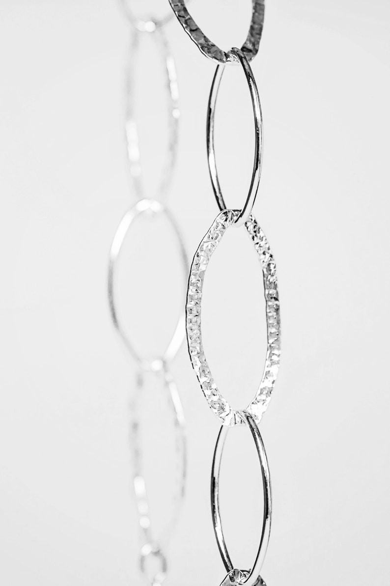 Long silver necklace hammered /& plain ovals .