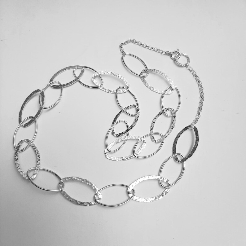 Long silver necklace hammered /& plain ovals .