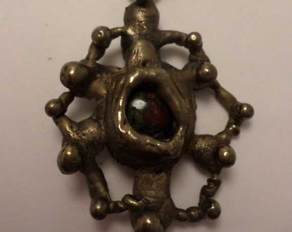 Vintage Brutalist West African Brass abstract pendant with glass center