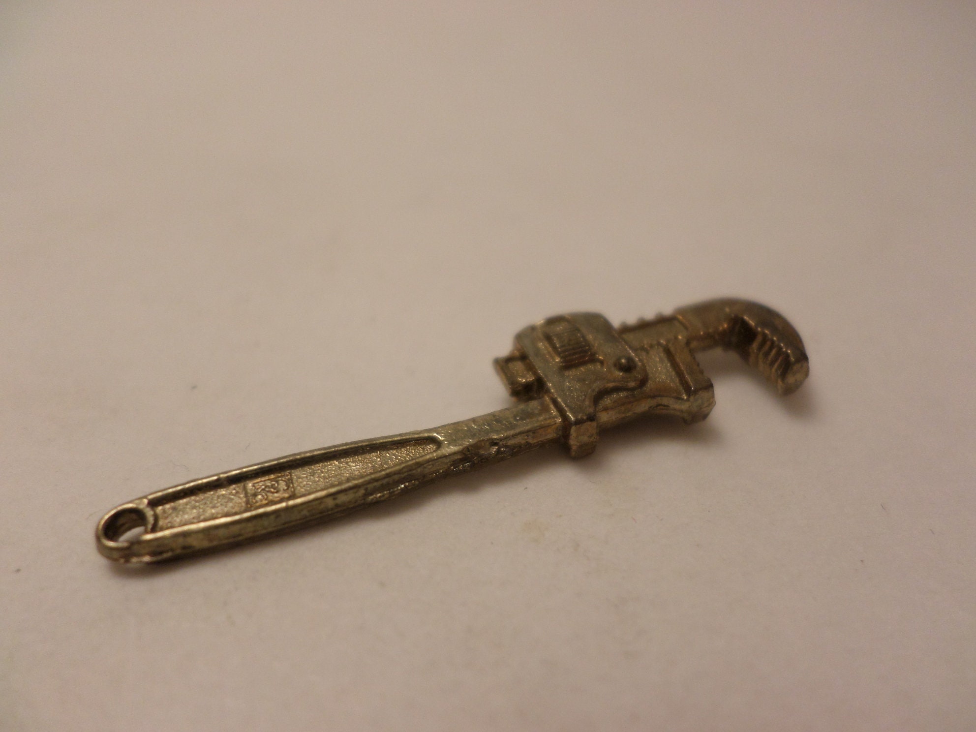 Vintage Intercast mini pipe wrench charm premium or advertising