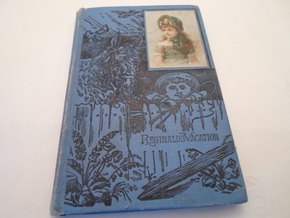 Antique 1890's Victorian Hard Cover Small Book Reginald's Vacation Beautiful Blue Engraved Front with Color Victorian Girl