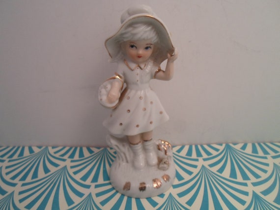 Vintage White Ceramic Figure Holding Bonnet and Basket Gold Leaf Trim Holly Hobby Lefton ? 1970's as is