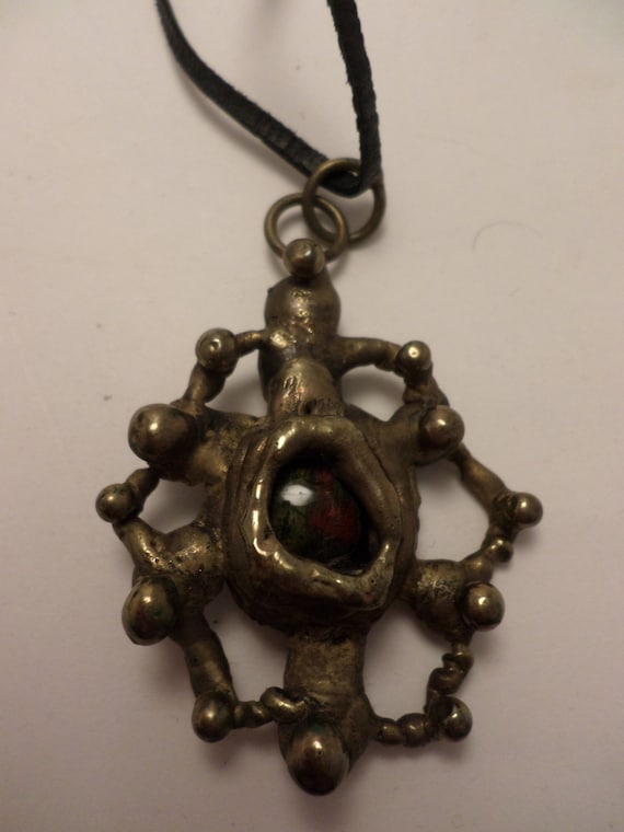 Vintage Brutalist West African Brass abstract pendant with glass center