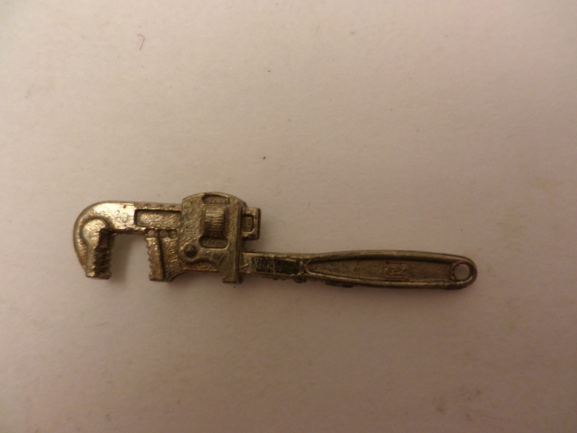 Vintage Intercast mini pipe wrench charm premium or advertising