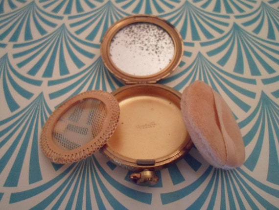 Vintage Henriette USA Powder Compact has crossed keys and oil lamp applied sorority mark as is