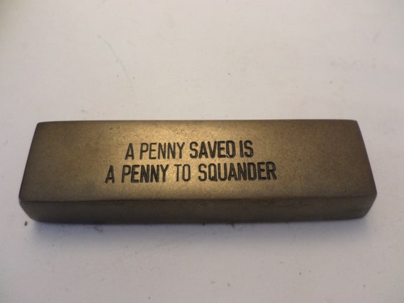 A penny saved is a penny to squander vintage paperweight heavy weighted felt bottom