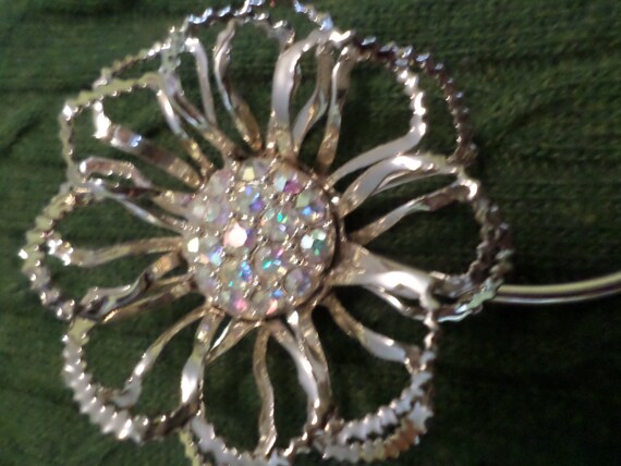 Vintage 80's Brooch light, airy chain shaped flower with center of borealis rhinestones marked Sarah on the back