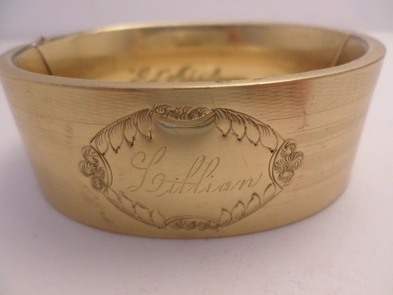 Beautiful 1" wide 1912 gold tone cuff bracelet Lillian inside marked Bob April 20 1912