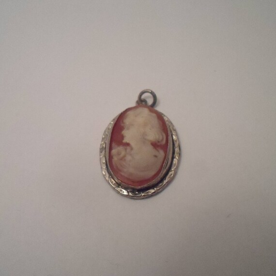Antique Small Shell Cameo Pendant Art Nouveau Woman Flowing Hair Holding Flowers Silver Bezel