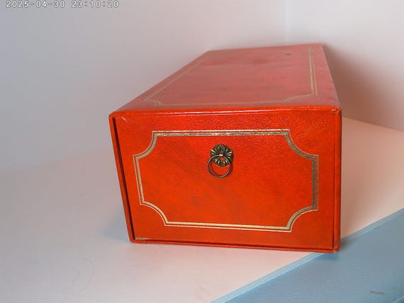 Vintage 60's-70's era Holson photo file box in distressed orange color with gold piping brass pull