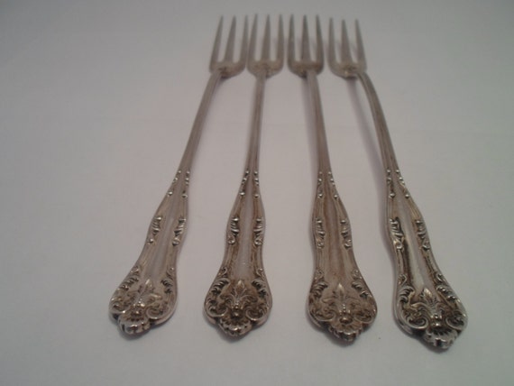 Sterling Silver 4 Seafood Forks Pattern on Front & Back marked Sterling Hallmarked with a Key