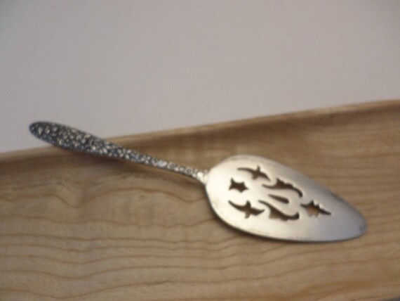 pretty little vintage sterling cheese or fruit server floral handle 5" long