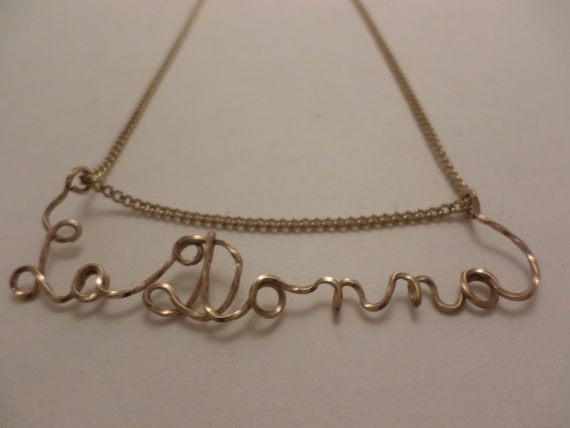 Vintage gold metal La Donna written necklace clever and chic!