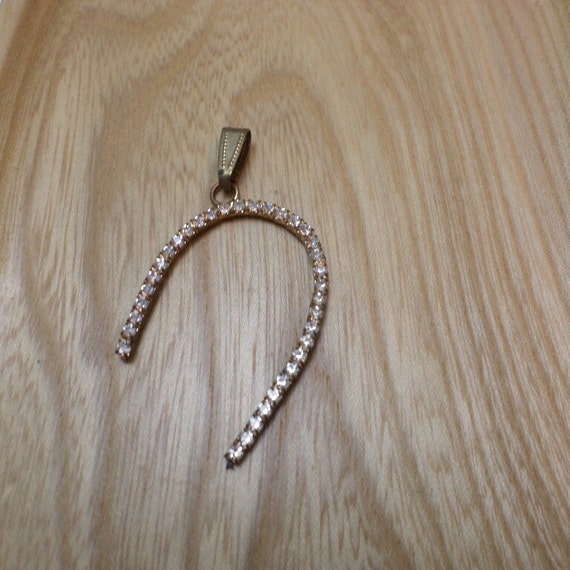 unique vintage brass backed rhinestone abstract horseshoe shape pendant